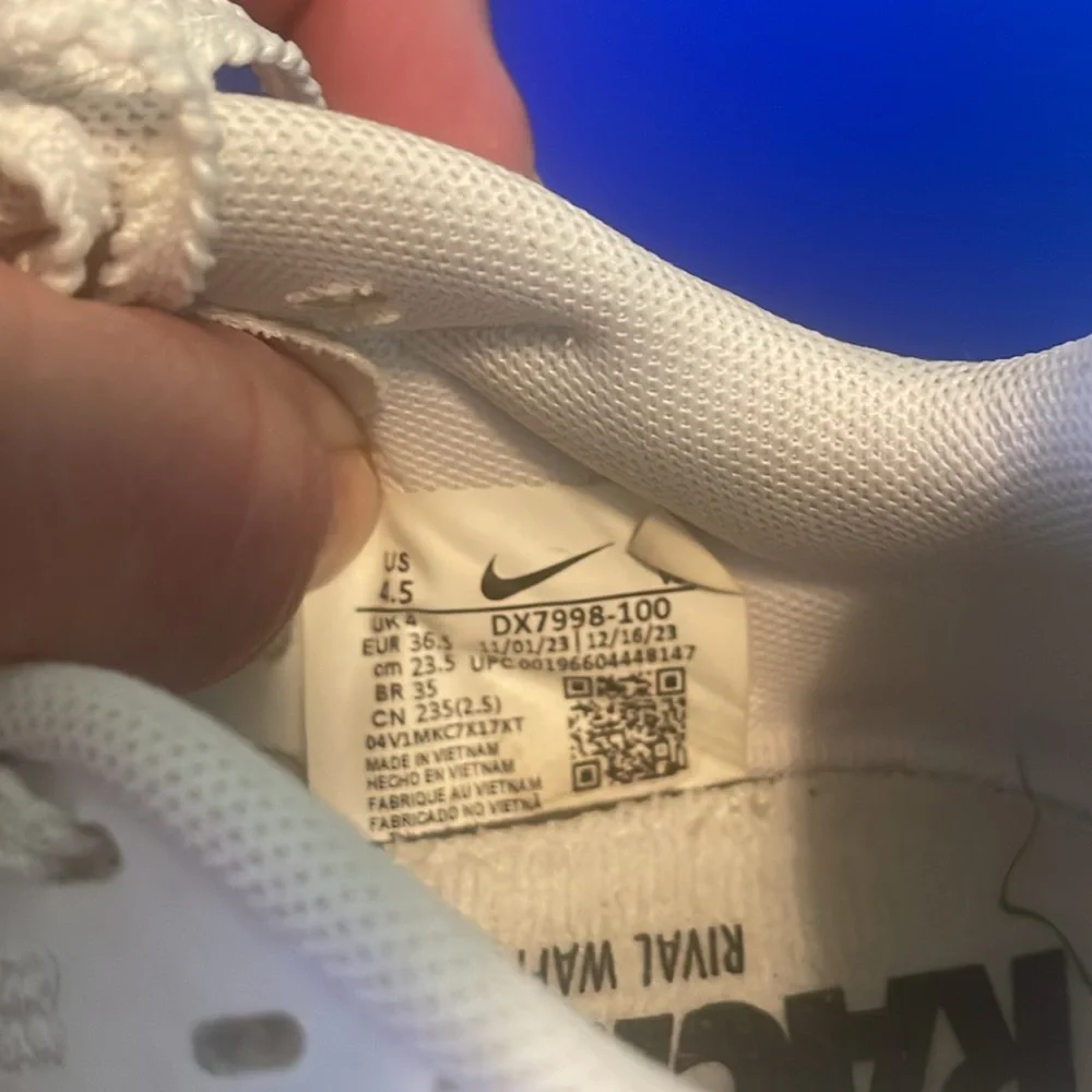 Nike Kids White Sneakers with Black Swoosh